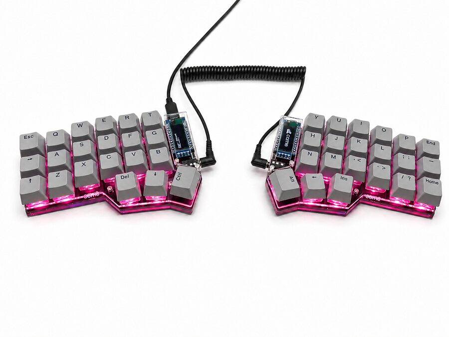 Assembled Corne with gray keycaps, photographed on a white background