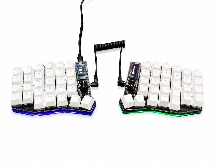 Assembled Sofle with white keycaps, photographed on a white background
